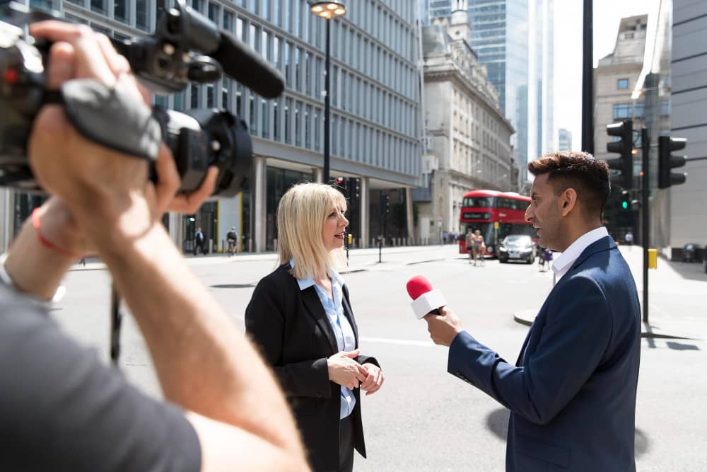 A reporter interviewing a lawyer about protecting the media to protect democracy