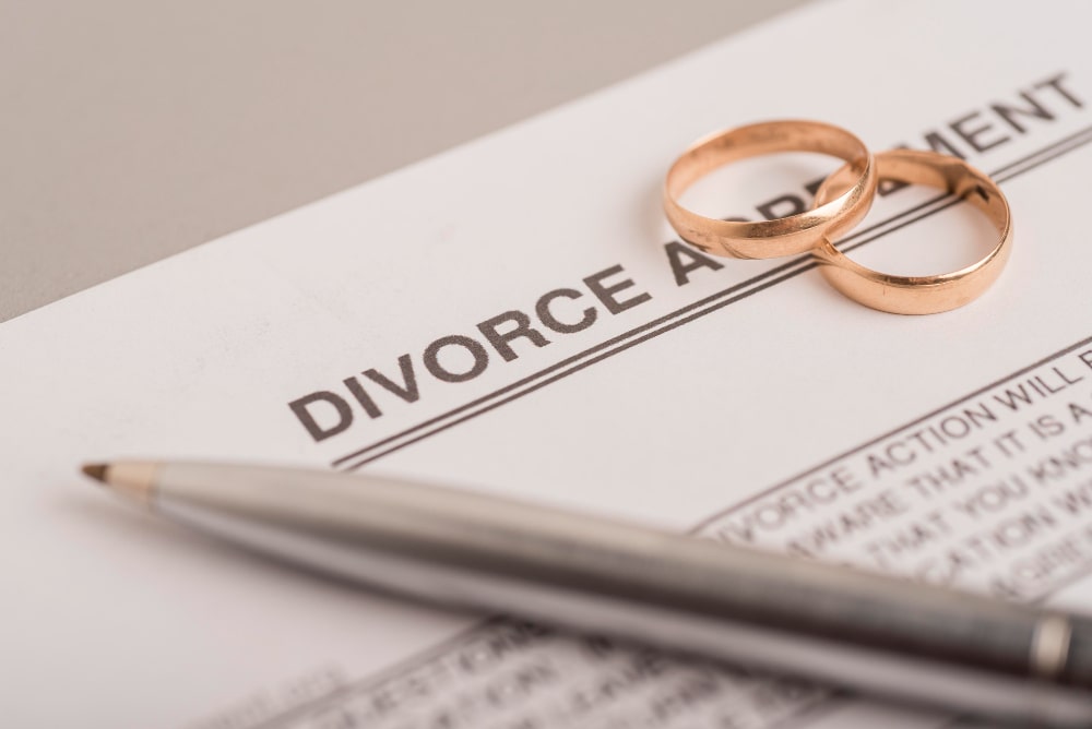 A couple handing over their wedding ring after the dispute related to International Marriage